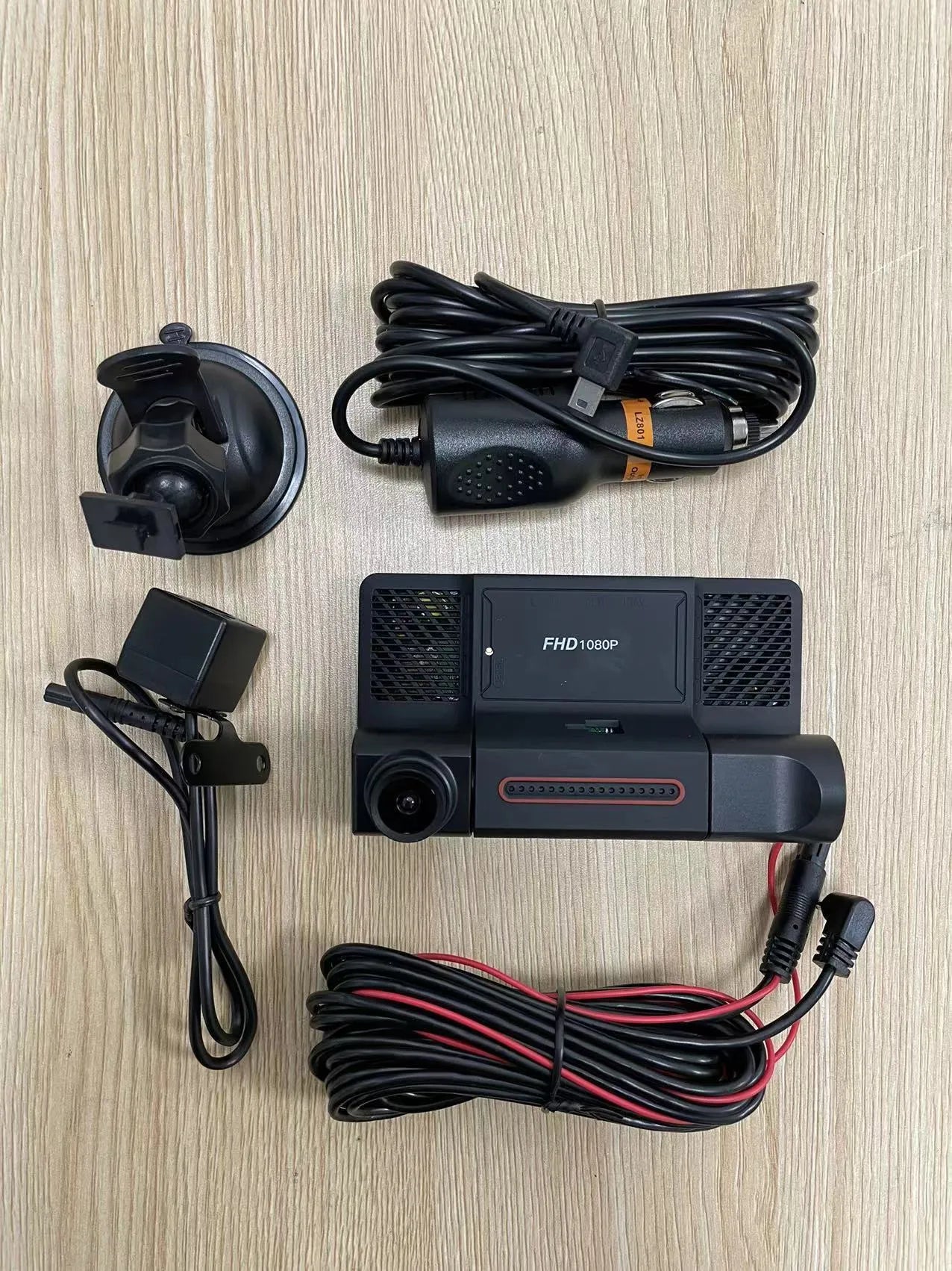 Black three-lens dash cam with 4-inch touch screen for front and rear vehicle recording