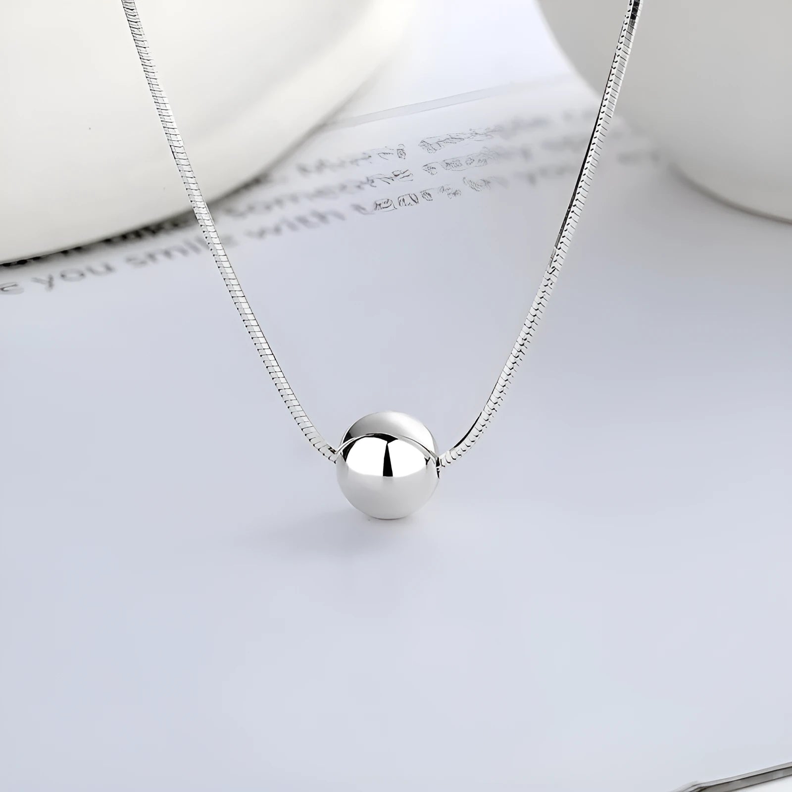 Small ball pendant on delicate 925 silver clavicle necklace with round YFL376 design