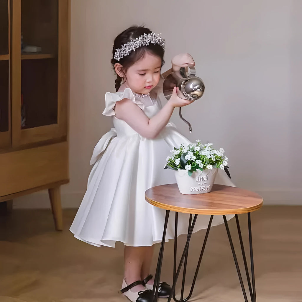 White satin princess dress for girls with puff sleeves, chemical fibre fabric, and flax lining on a white background