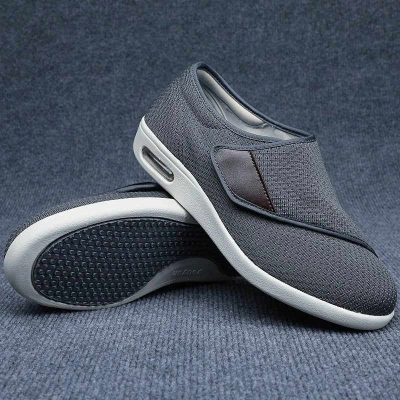 Beige leisure shoes with a velcro strap, textile and synthetic leather upper, and a rubber sole.