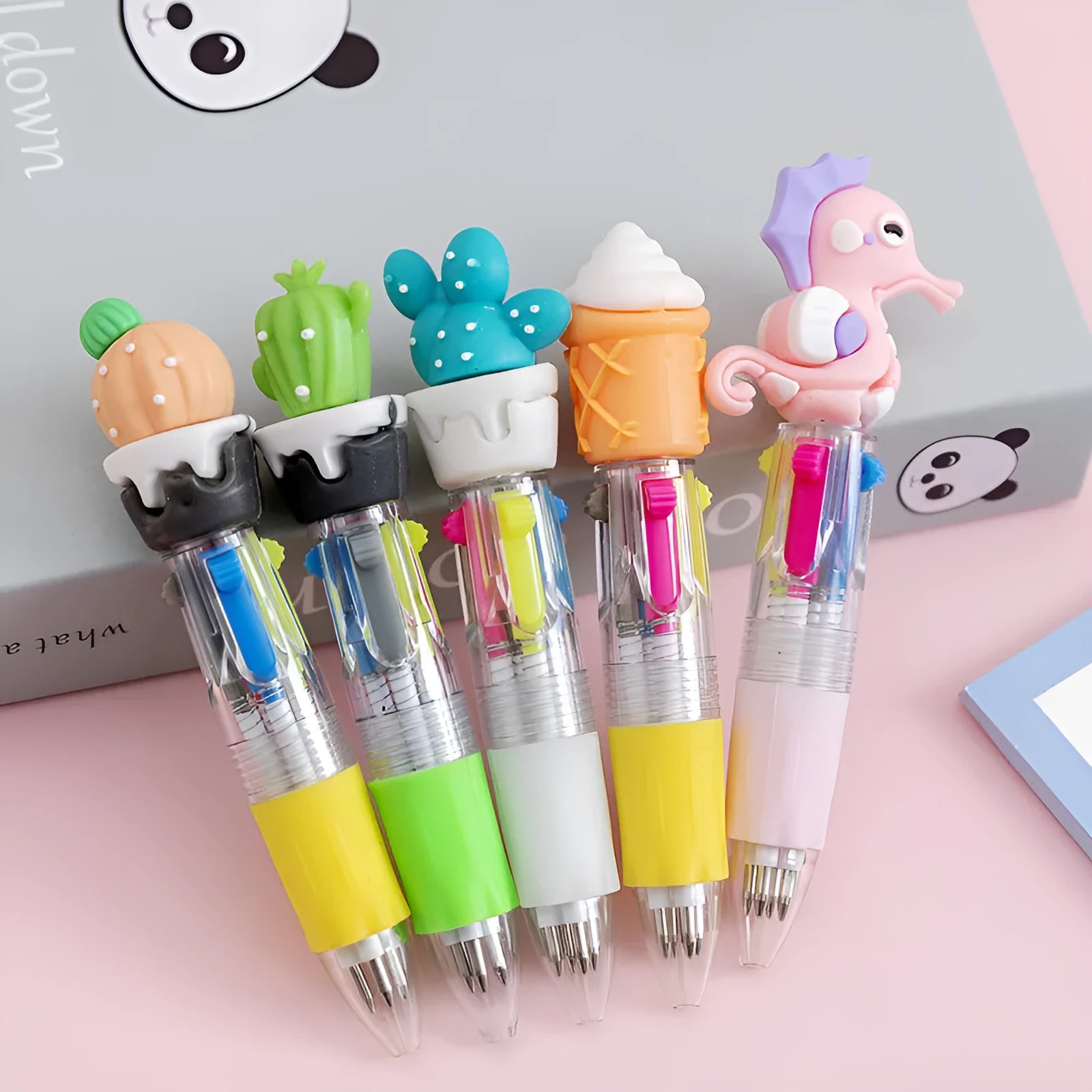 Four-colour press ballpoint pen with a random cute cartoon design, such as cactus or fast food, showing its press mechanism.