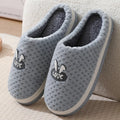 Women's rabbit plaid design winter slippers with artificial fur upper and thick rubber sole.