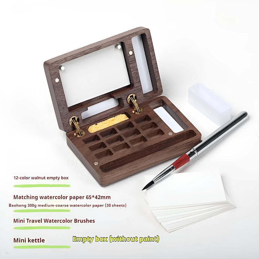 Mini walnut wood paint box open showing compartments for watercolour pigment pans.