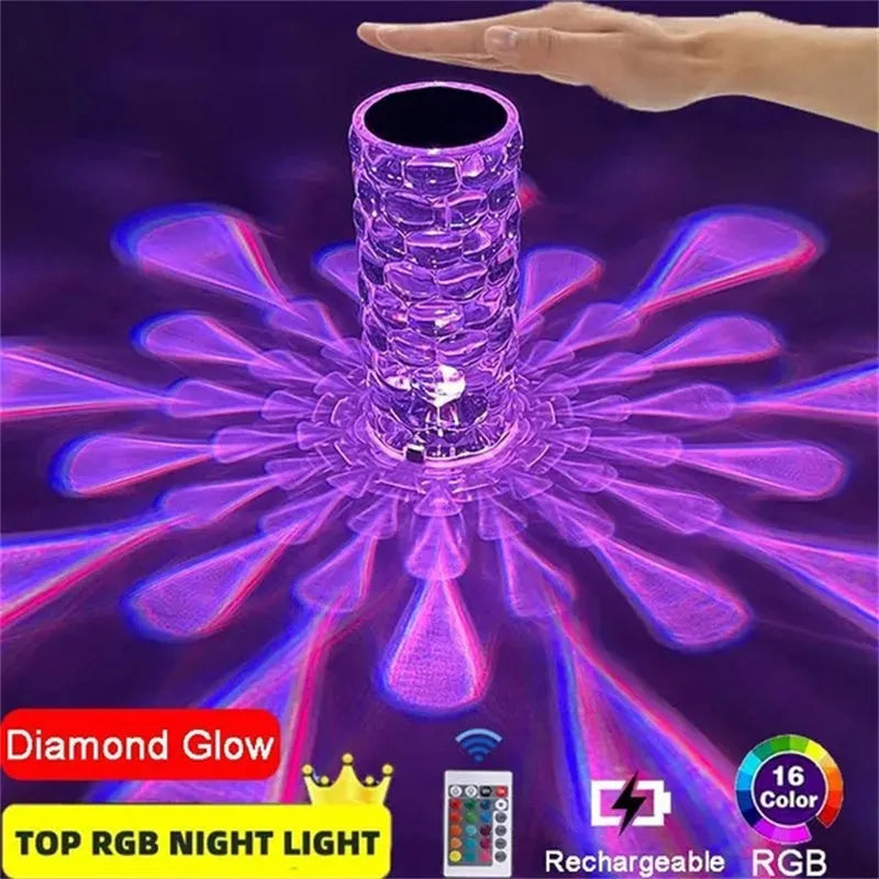 Crystal table lamp rechargeable with teardrop acrylic shade showing droplet shadow effect on a bedside table