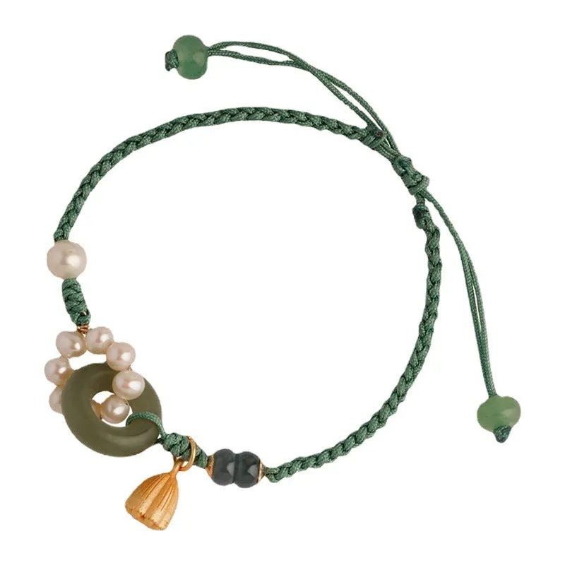 Hand-woven DIY watch band with flexible wire and a round pearl peace buckle closure.
