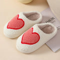 Women's plush cartoon love style slippers with a PVC sole in multiple colour options.