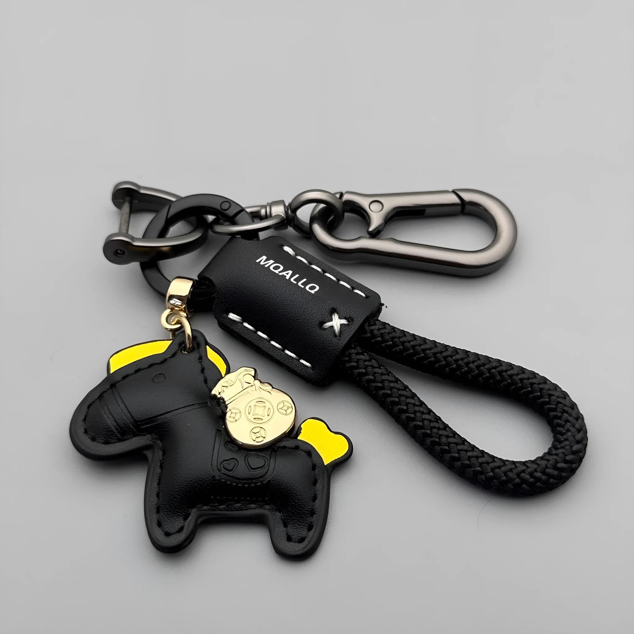 Handmade brown cowhide key ring pendant with zinc alloy pony buckle and green flanelle rope.