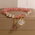 Women's natural crystal bracelet with strawberry quartz and white agate beads, auspicious cloud accents, 40g, on white background