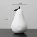 Solid resin apple figurine with smooth apple finish, 17cm high, in black colour on a shelf