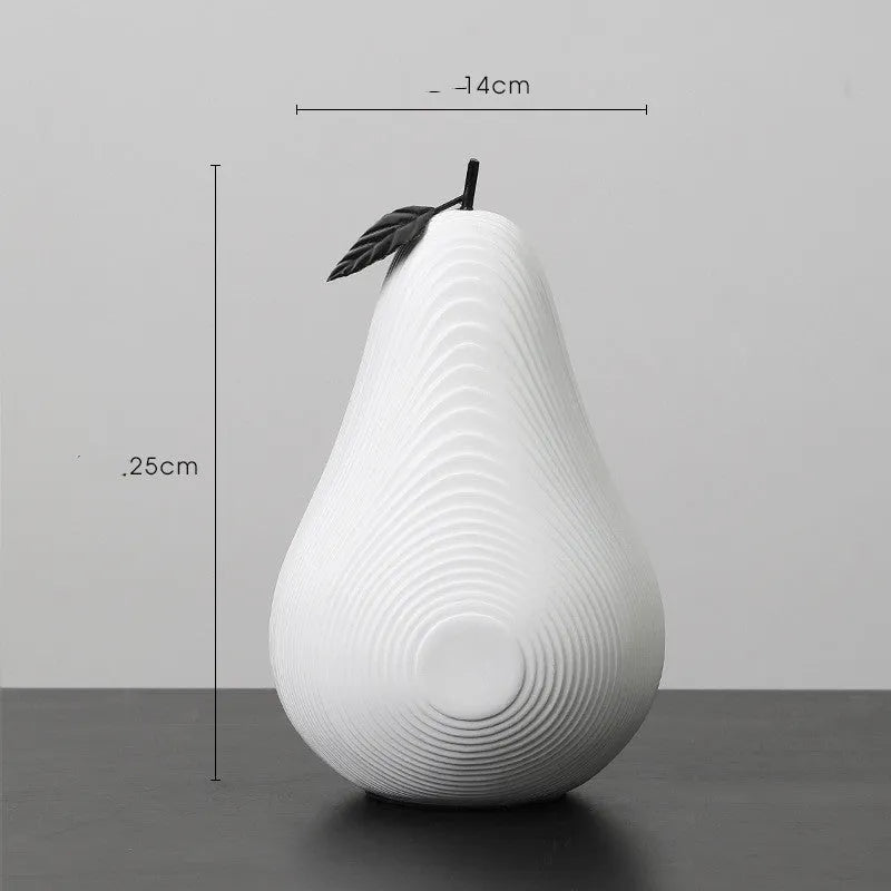 Solid resin apple figurine with smooth apple finish, 17cm high, in black colour on a shelf