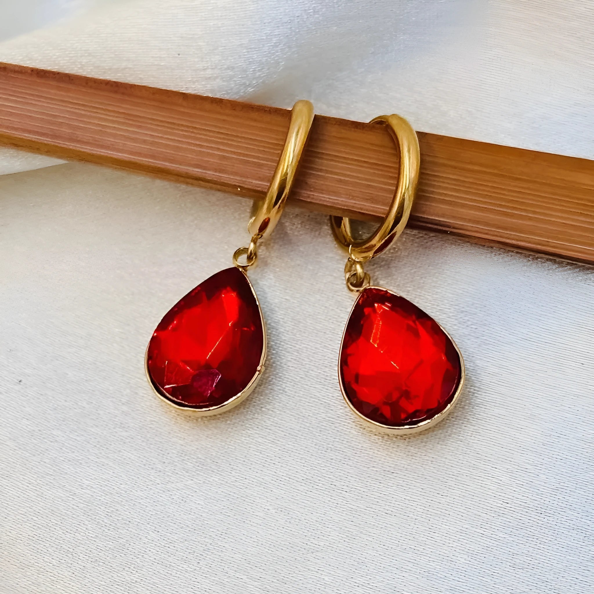 Geometric carved earrings in glass, copper, and colourful rare earth, Saturn and water drop design, available in twelve colour options