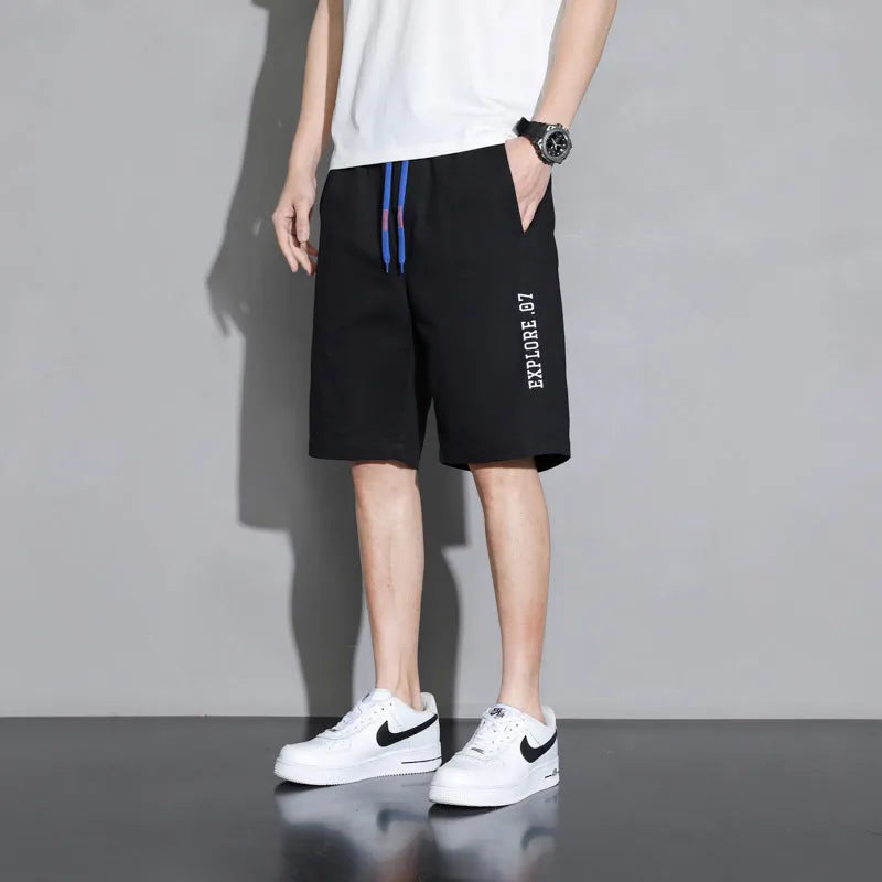 Boy wearing khaki cotton shorts with mid-waist, showing front view.