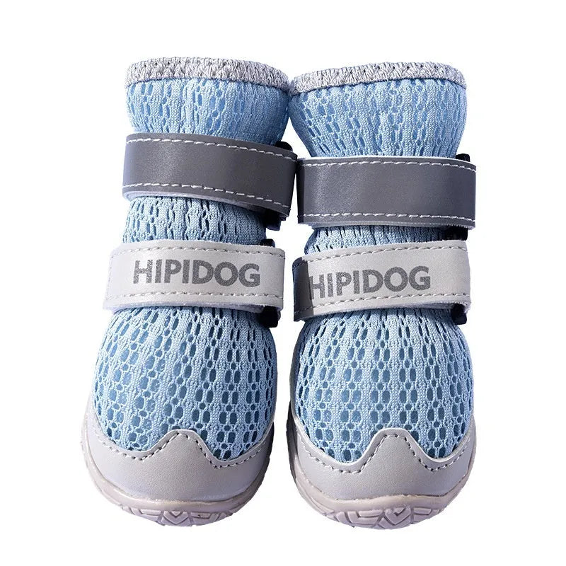 Pair of light blue cartoon-style dog shoes with breathable PU material on a white background.