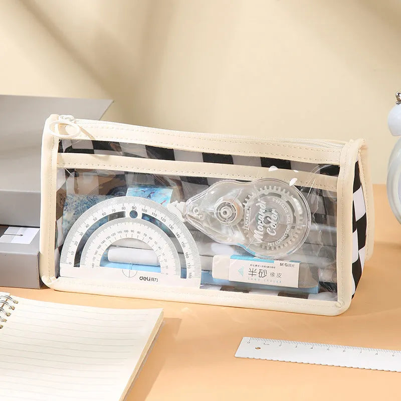Large transparent PVC pencil case with internal black and white chessboard grid design.
