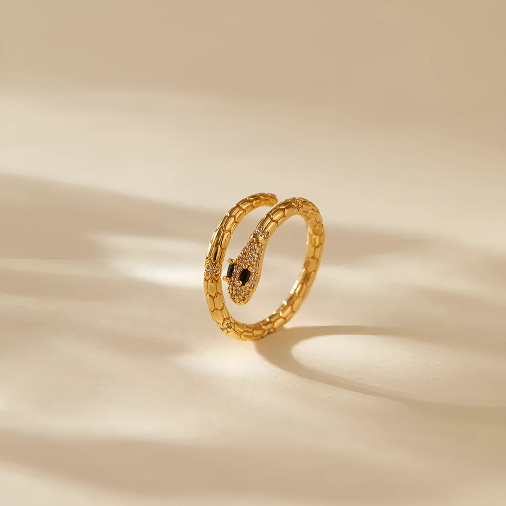 Snake-shaped adjustable copper ring with gold colour plating and diamond surface treatment