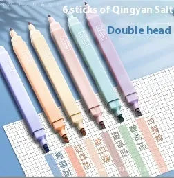 Set of double-ended fluorescent highlighting pens in mixed colours on a white background.