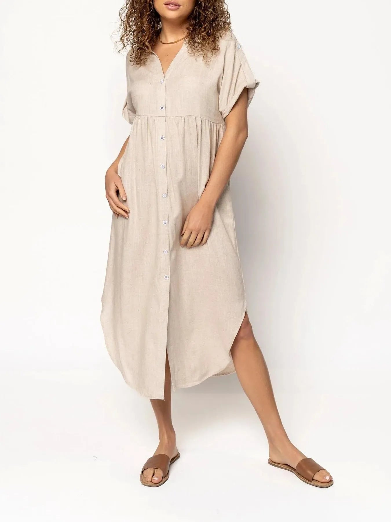 Loose-fitting casual midi dress with buttons down the front, shown in a solid colour.