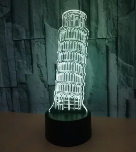 3D laser-cut Leaning Tower of Pisa acrylic night light glowing in blue on a black base.