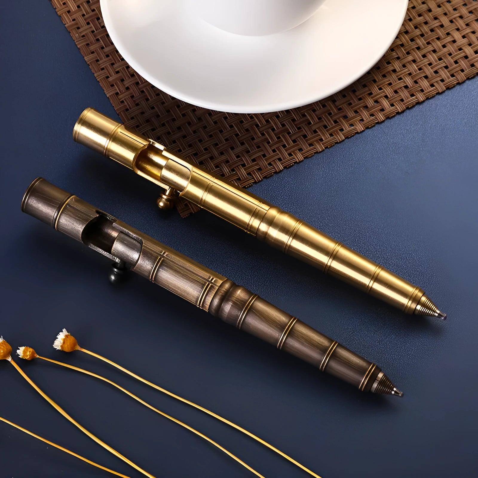 Brass bolt-action tactical pen with cylindrical barrel and press mechanism in retro finish