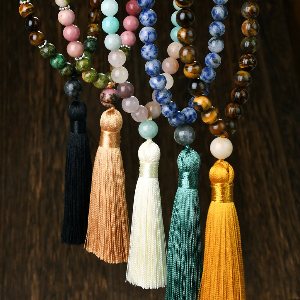 Long 108-bead natural stone necklace with a geometric tassel pendant in bohemian style.