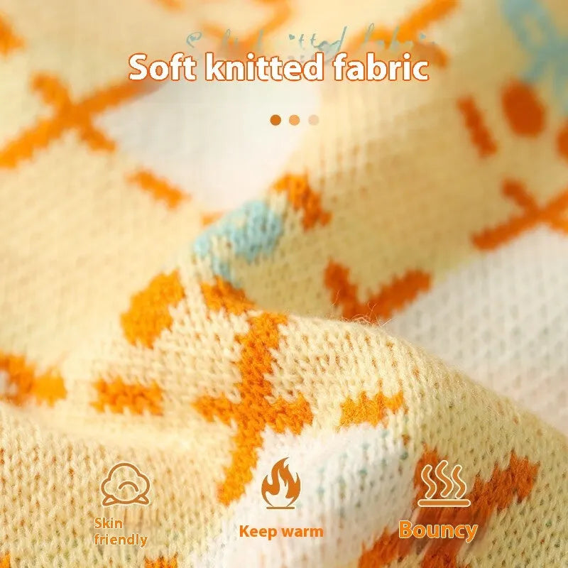 Orange diamond knit cat jumper showing chest measurement points and size labels