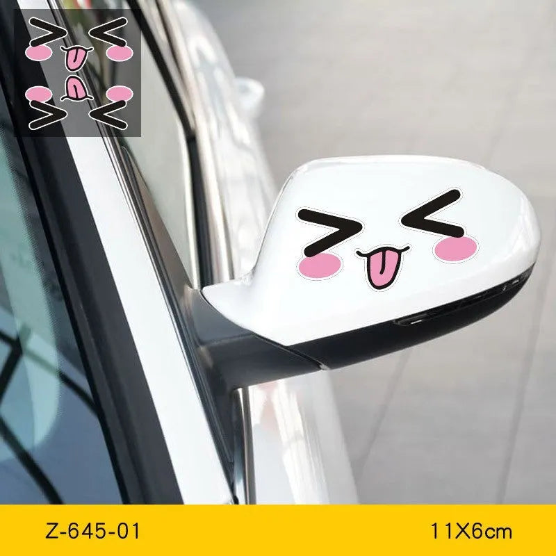 Pair of reflective cartoon eye car stickers on a vehicle rearview mirror and door panel.