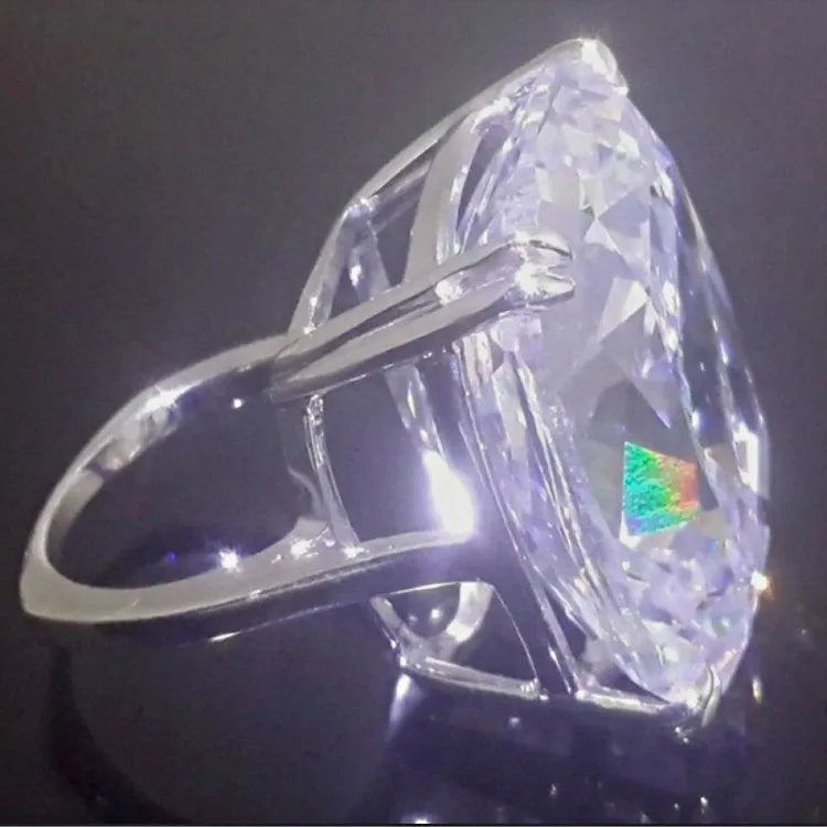 Women's square diamond ring with electroplated white gold colour and geometric design showing inlaid white stones