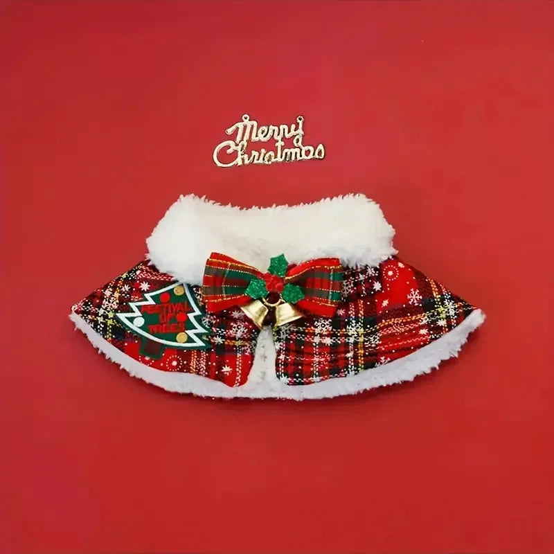Red festive pet scarf with bell pattern draped on a dog, showing the cloak-style design for winter and holiday use.