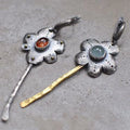 Long geometric flower earrings with two-tone asymmetrical colour on alloy metal.