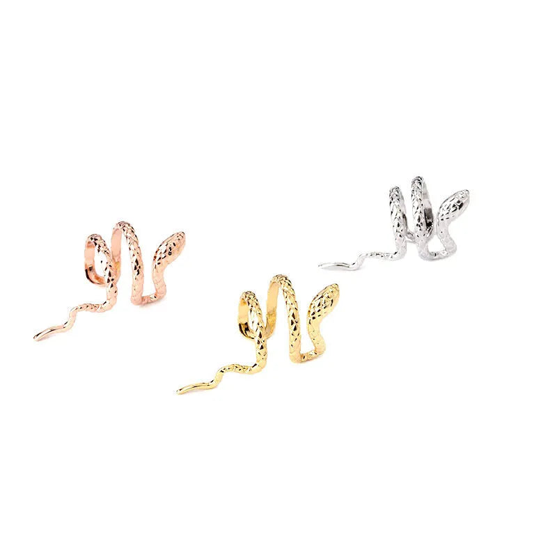 Metal snake-shaped ear clip non-piercing earring in silver finish on earlobe