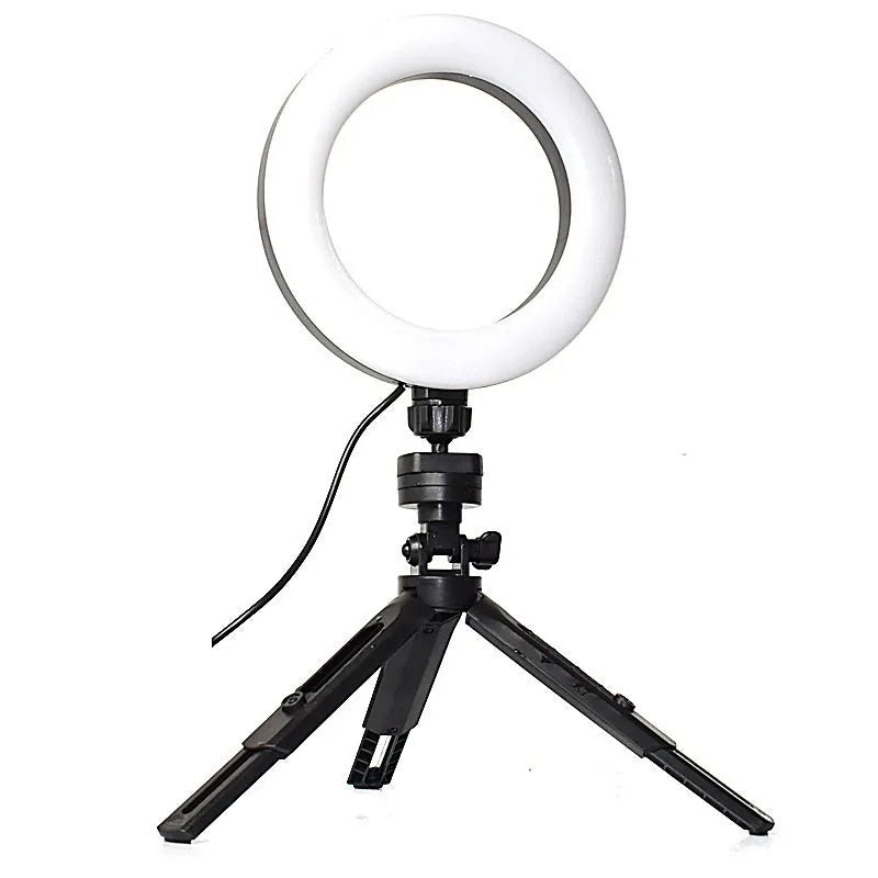 Black smartphone desktop tripod suit with adjustable colour fill light and universal clip mount.