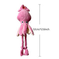 Pink squid-shaped plush dog toy with rope texture and a built-in squeaker.