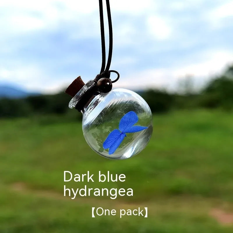 Glass car perfume pendant with preserved flowers for interior decoration and air freshening