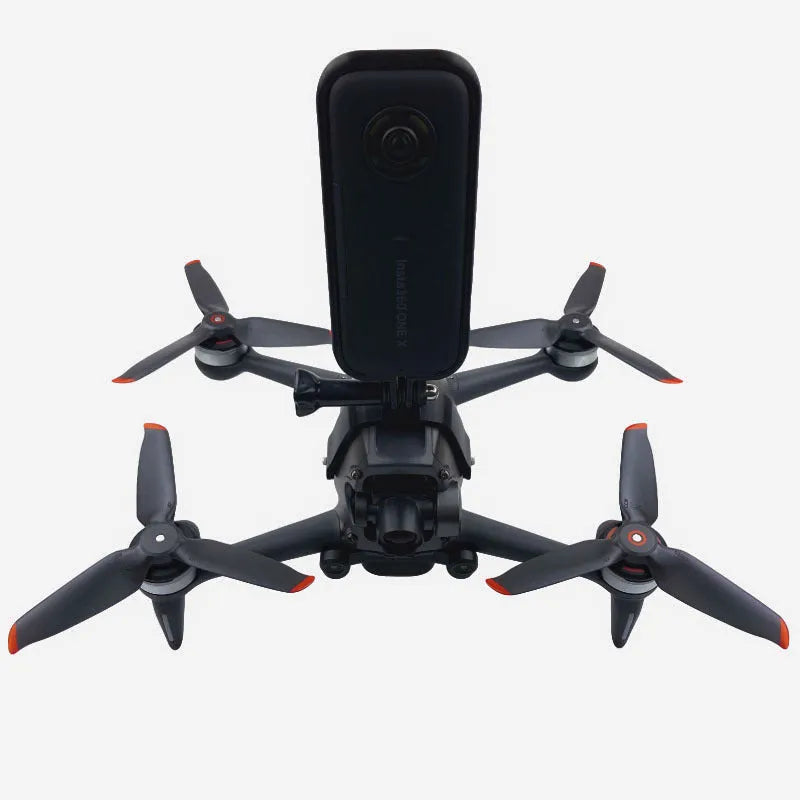 3D-printed hard plastic FPV drone top expansion bracket with soft sponge pad for mounting GoPro cameras.