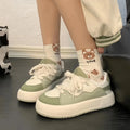 Green women's casual shoes with PU mesh upper and round toe on a flat, non-slip sole.