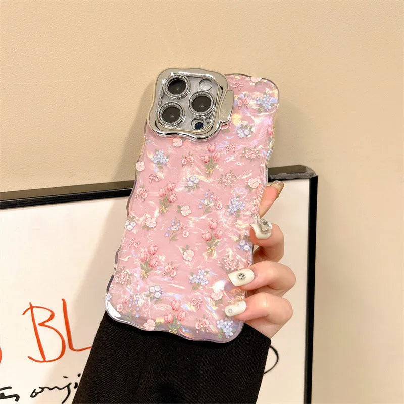 Wave pink acrylic iPhone case with embossed floral shell pattern and invisible brackets