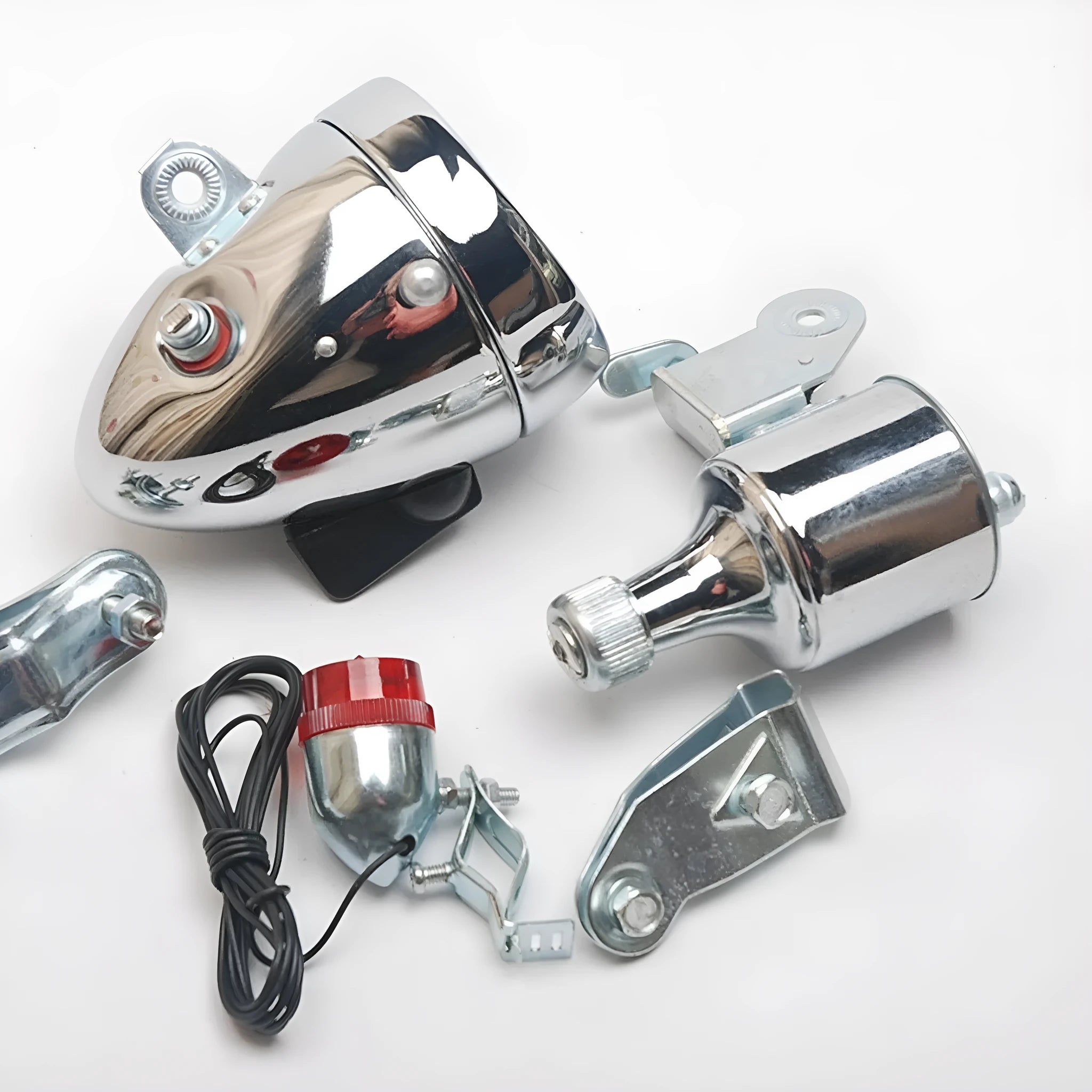 Silver bicycle dynamo-powered generator light kit for mounting on frame, showing wiring connectors.
