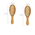 Carbonized bamboo massage comb 66x218mm on a neutral background, showing natural wood texture and teeth