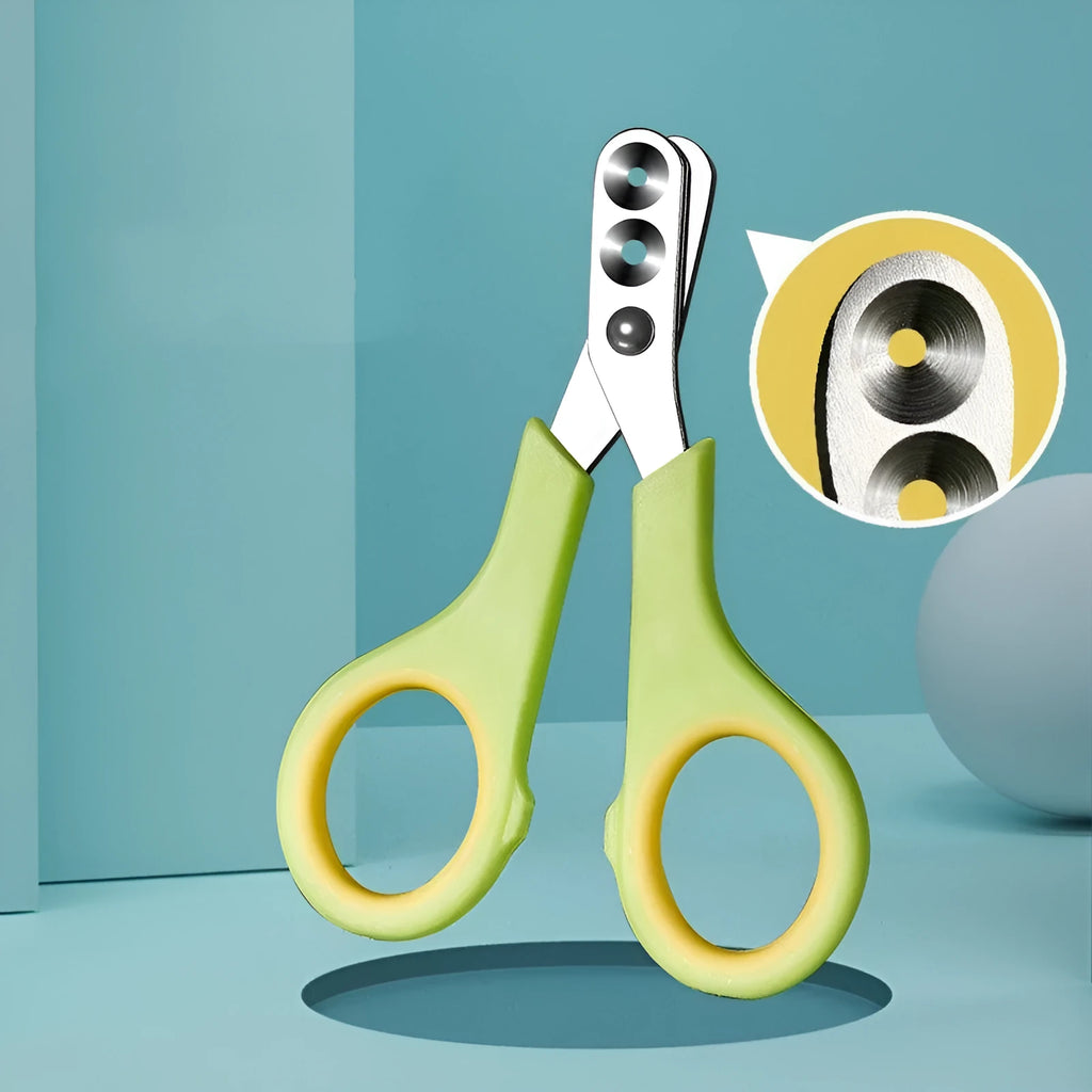 Manual cat nail clippers with round metal blade and green handle, designed for even nail cutting and split prevention