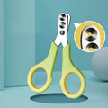 Manual cat nail clippers with round metal blade and green handle, designed for even nail cutting and split prevention