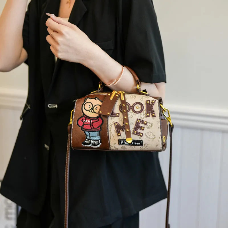 Brown PU handbag with printed cartoon design, horizontal square shape, and single shoulder strap
