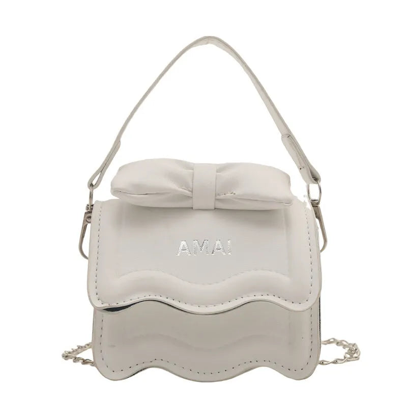 Mini crossbody bag in seven colour options with single shoulder strap and structured PU construction