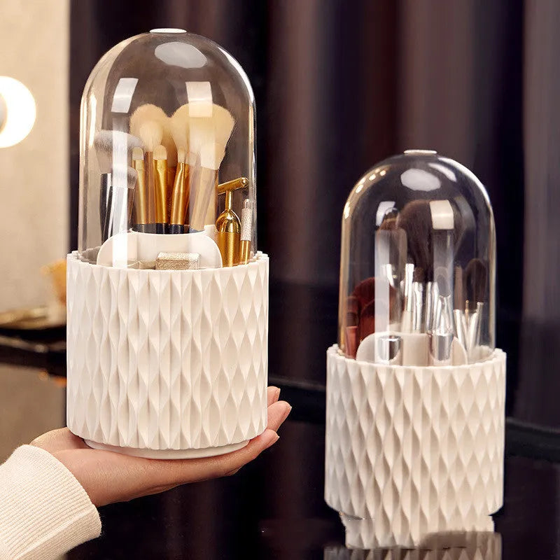 White acrylic rotating makeup brush holder with transparent dust cover showing split storage compartments