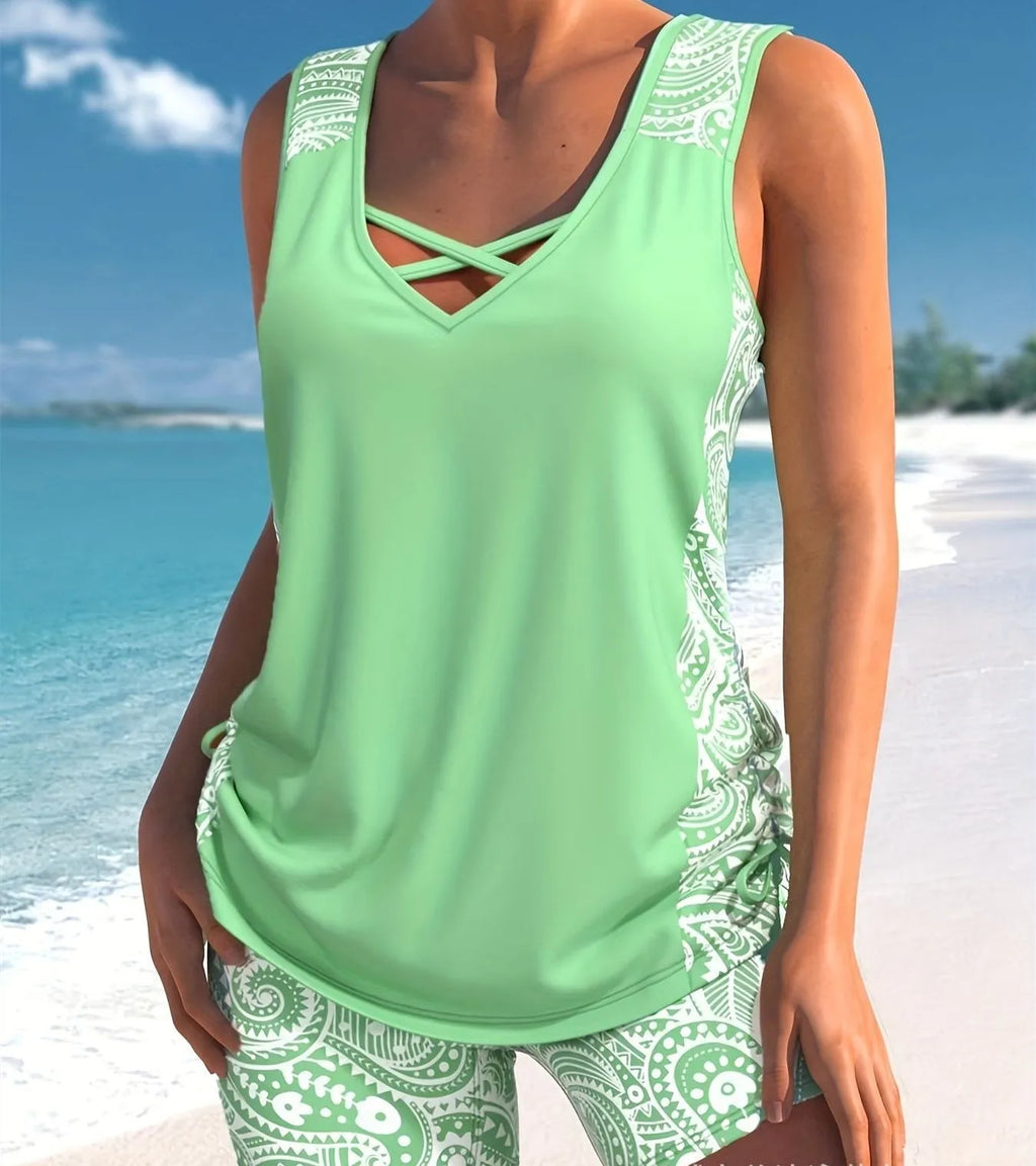 Women's printed split boxer swimsuit set with matching top and shorts on a mannequin.