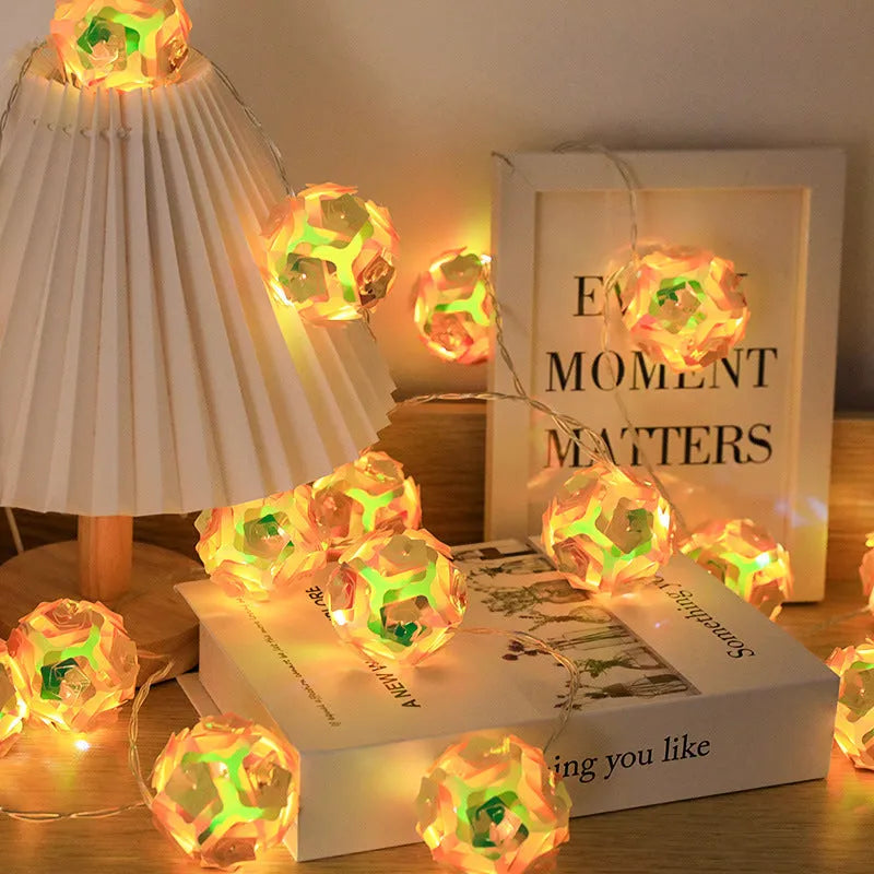 Laser rose windmill LED lamp string with crystal orange light colour on a dark background showing 5cm beads