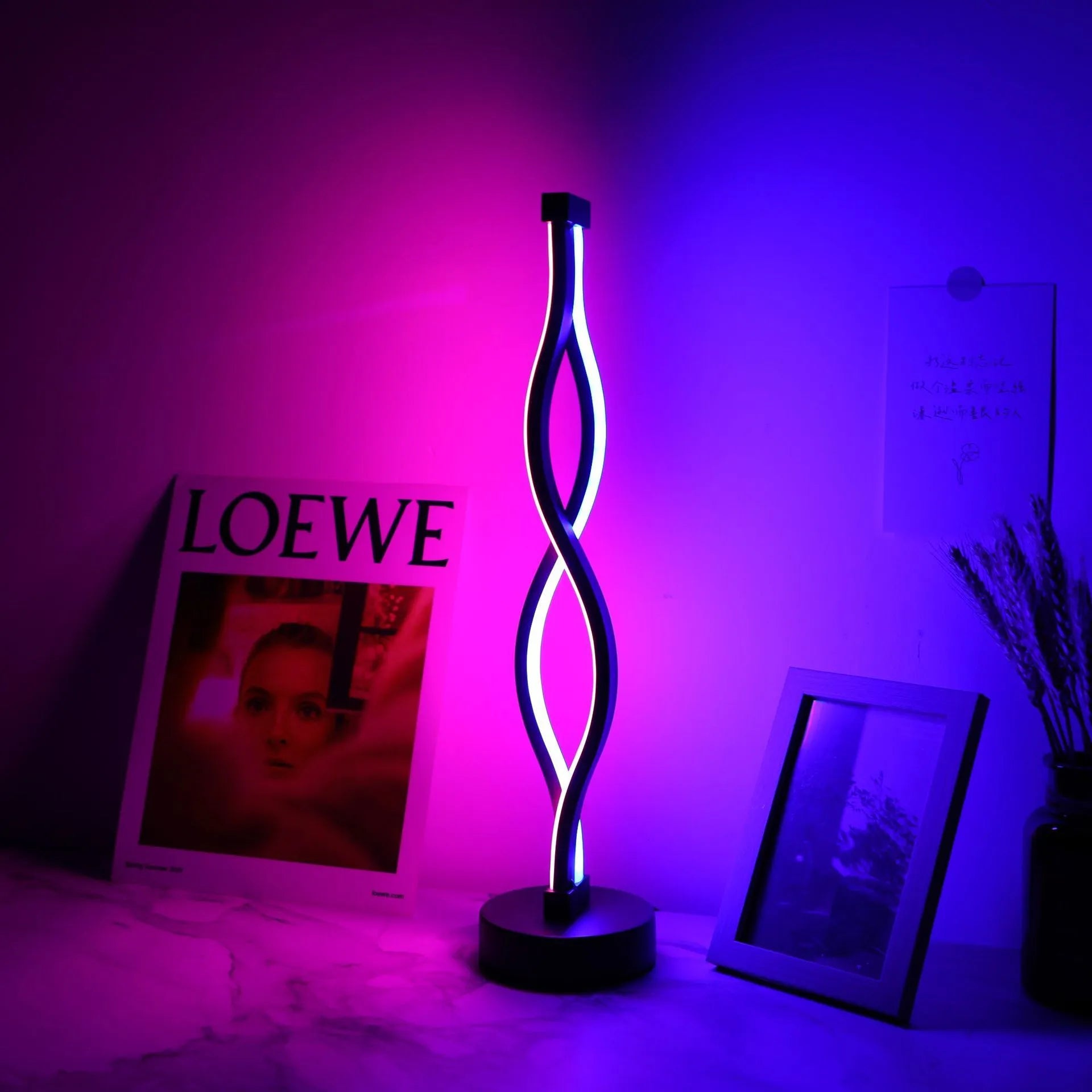 Black aluminium desk lamp with touch controls and three-colour dimming button