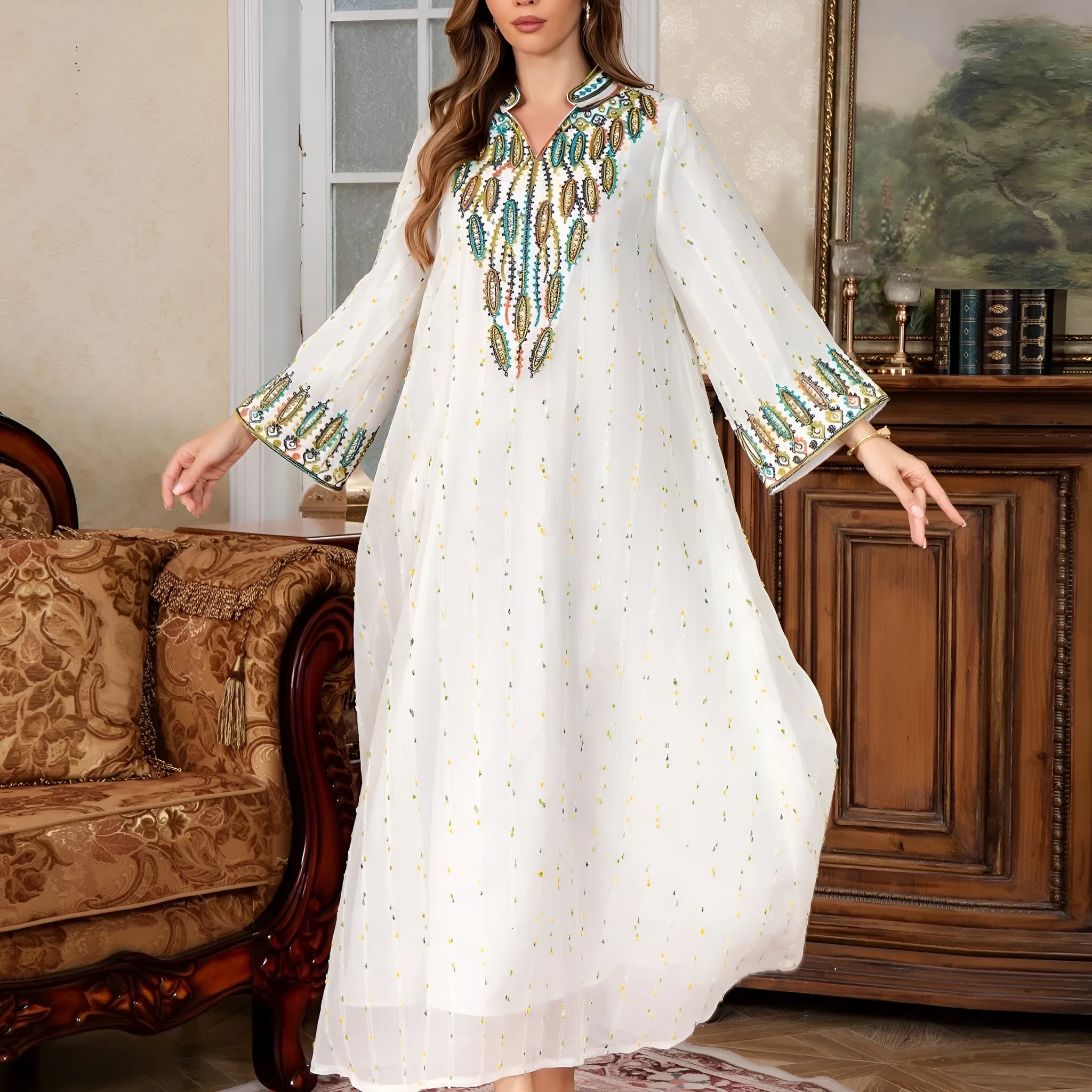 White long sleeve Arabic robe abaya on a hanger, full-length polyester maxi dress.