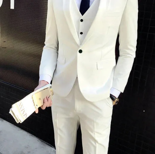 Men's white slim fit cotton blend suit set with jacket, vest, and trousers on a hanger