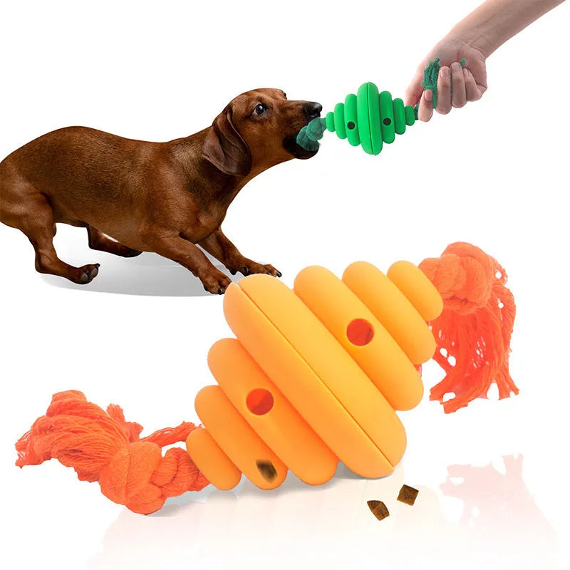 Green and yellow silicone dog ball with knotted rope attached, showing food dispenser openings.