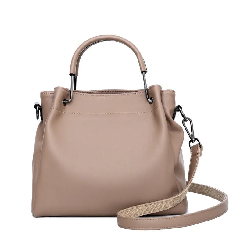 Leisure soft leather bucket bag in black with slit pocket and visible sewing thread detail for commuting